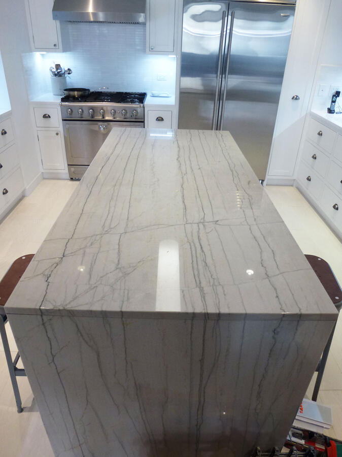 A white marble kitchen island