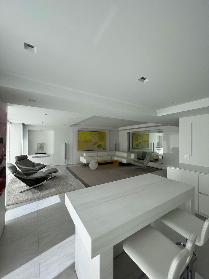Bathroom stall with wooden paneled floors and a foldable wooden seat