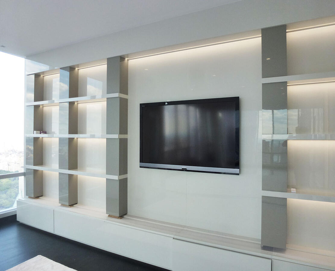 Brightly lit white kitchen with marble counters