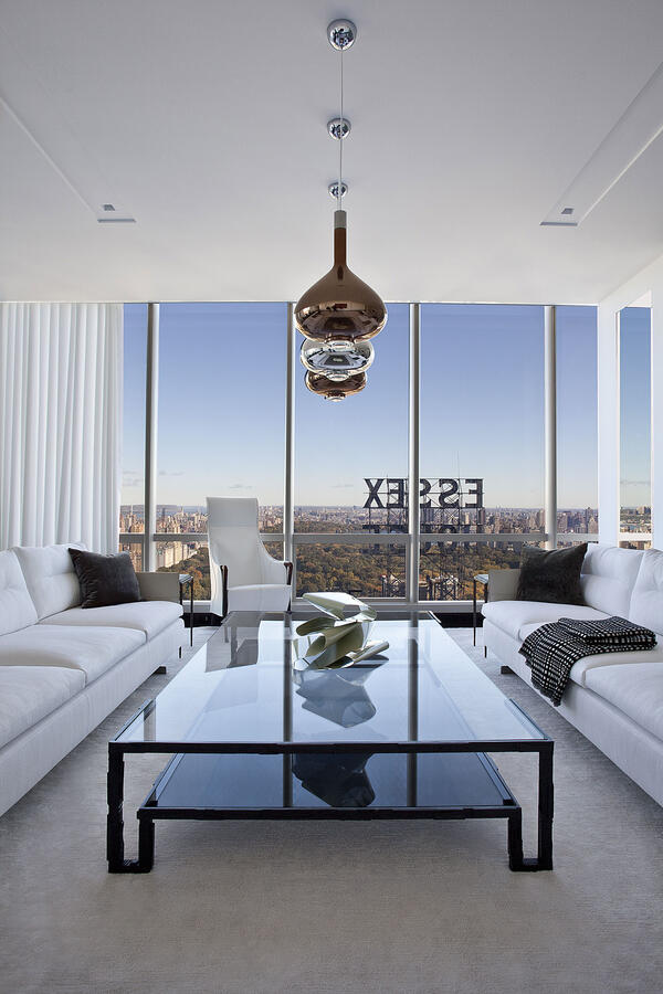 A white room with an Asian patterned separator made of wood