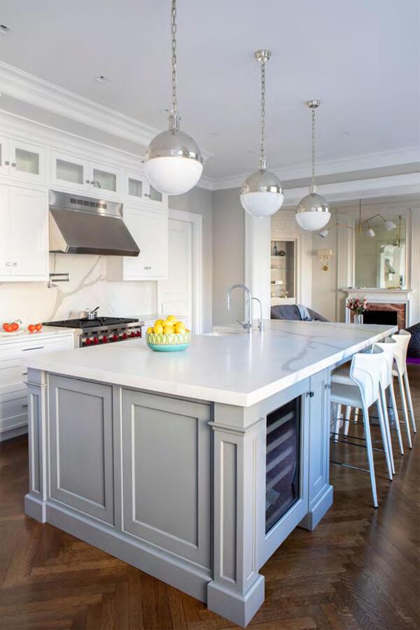 Brightly lit bathroom with 2 mirrors and a double vanity sink