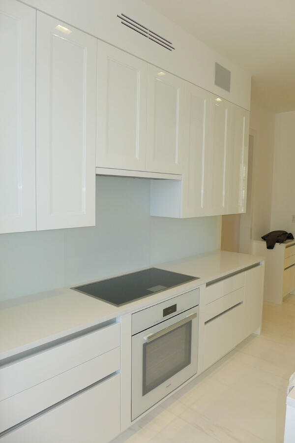 A white room with an Asian patterned separator made of wood